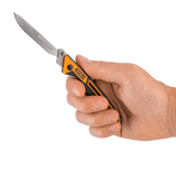 Spika Command folding scalpel opened and held in hand to show the compact handle and blade size
