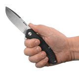 Spika Bushmaster Raider folding knife opened and held in hand to show grip fit and blade size