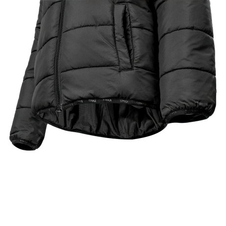 Spika Terra kids' puffer jacket in Black, close-up of the elastic hem and hand pocket