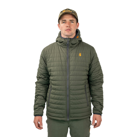 Man wearing the Spika Chase hooded puffer jacket in Olive with a camo cap, front view