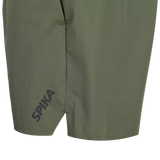 Close-up of the split hem and SPIKA leg print on Spika GO Arid men's olive quick dry shorts