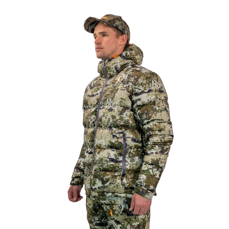 Man modelling the Spika Terra men's puffer jacket in Biarri Camo, three-quarter view