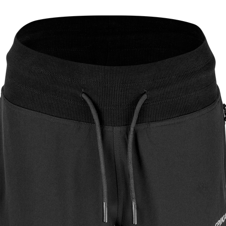 Close-up of the wide ribbed waistband and drawcord on Spika GO Casual women's black jogger pants