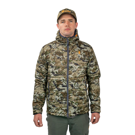 Man wearing the Spika Chase hooded puffer jacket in Biarri Camo with a camo cap, front view