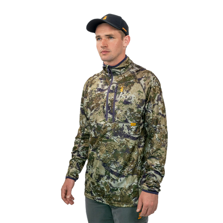 Man wearing the Spika Guide men's lightweight top in Biarri Camo, three-quarter side view